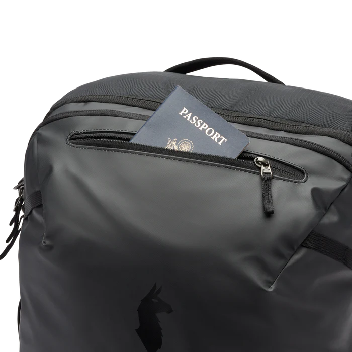 Cotopaxi Allpa 35L Travel Pack Black another zip pocket showing a passport
