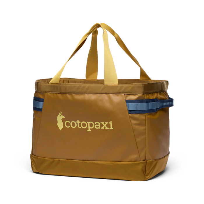 Brown tote bag with yellow straps and Cotopaxi logo on a white background
