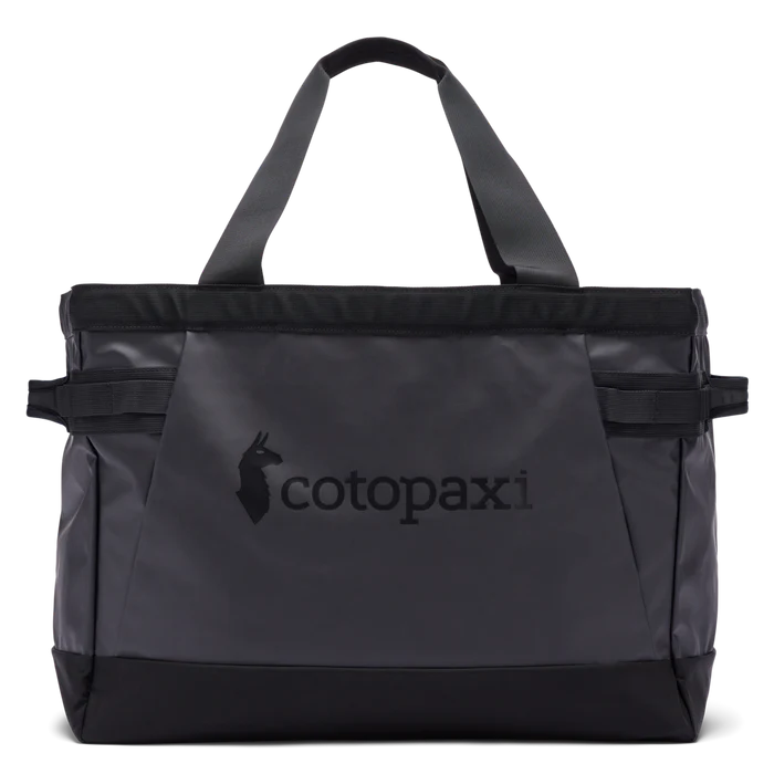 Black tote bag with 'cotopaxi' logo on a white background