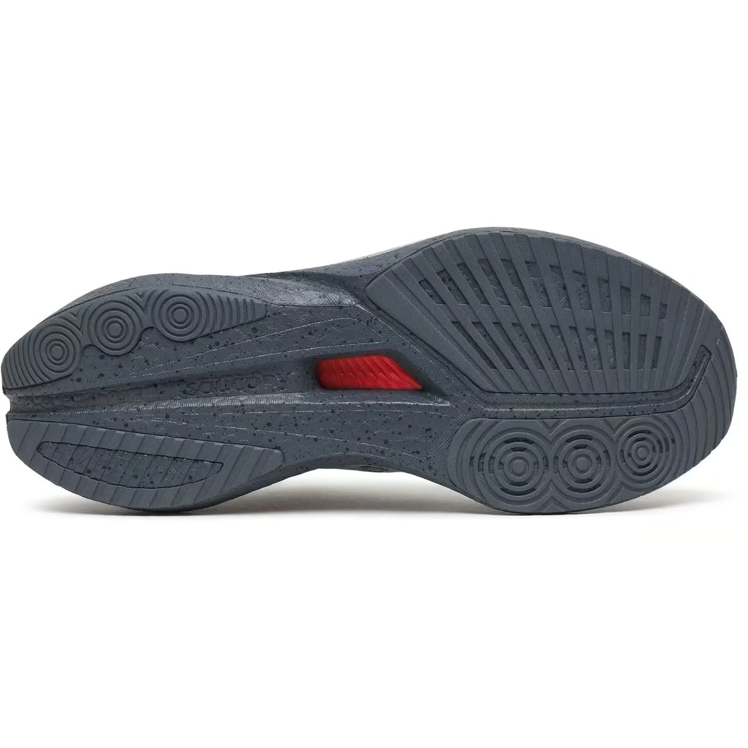 Sole of a gray athletic shoe with a red label on a white background