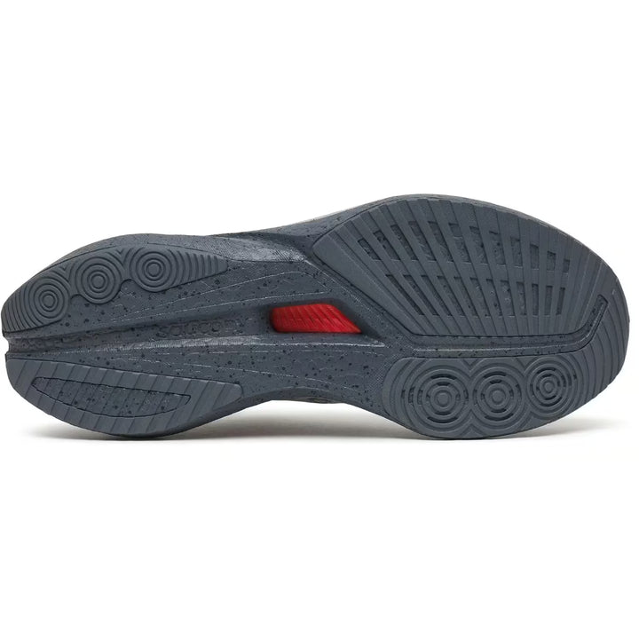 Sole of a gray athletic shoe with a red label on a white background