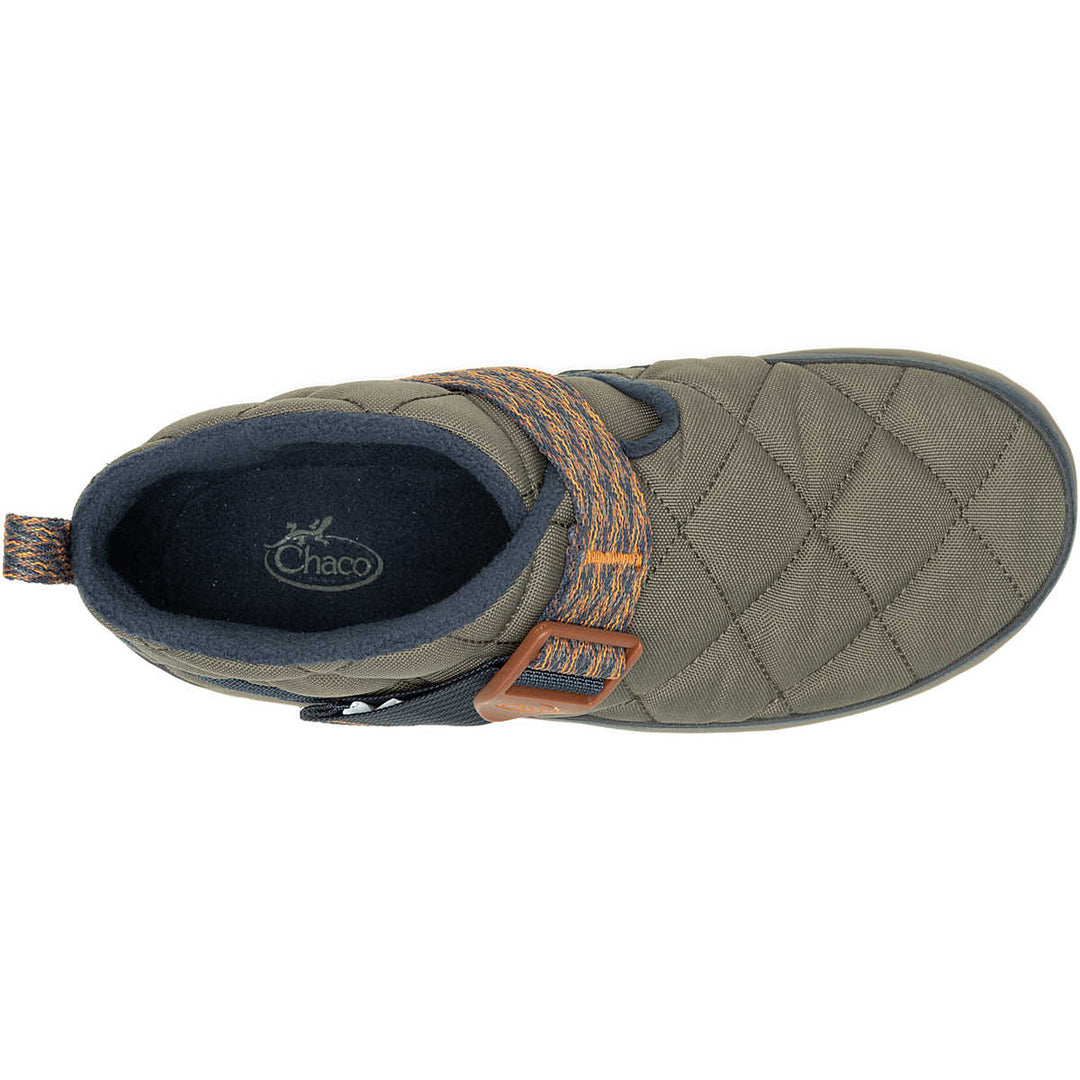 Green quilted shoe with brown accents on a white background