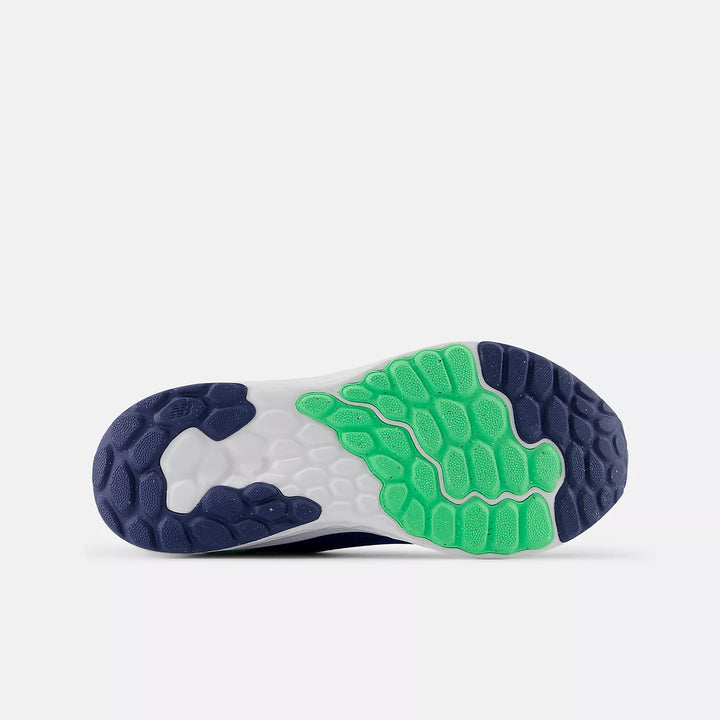 Close-up of a shoe sole with green and blue design on a white background