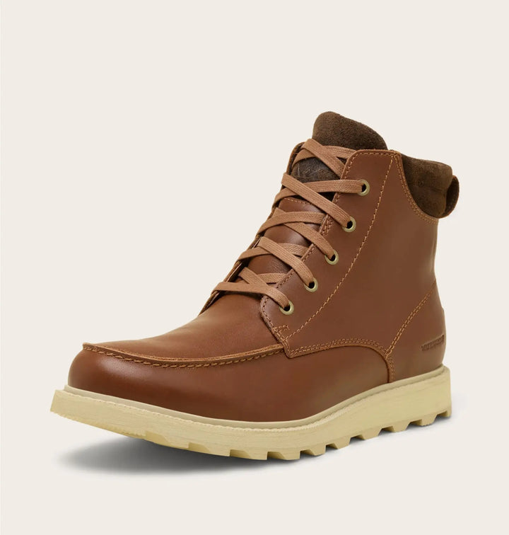 Brown leather boot with a beige sole on a light gray background