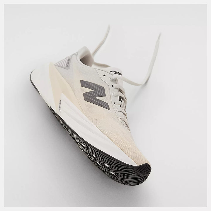 White running shoe with New Balance Fuel Cell Rebel V5 5